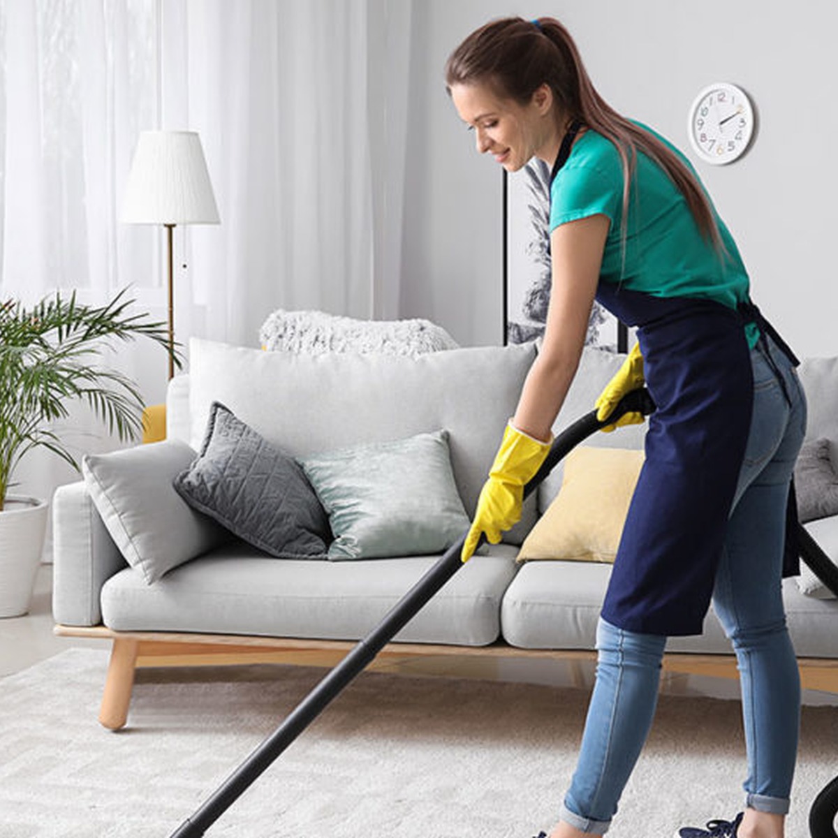 Professional maid service team cleaning a kitchen near me