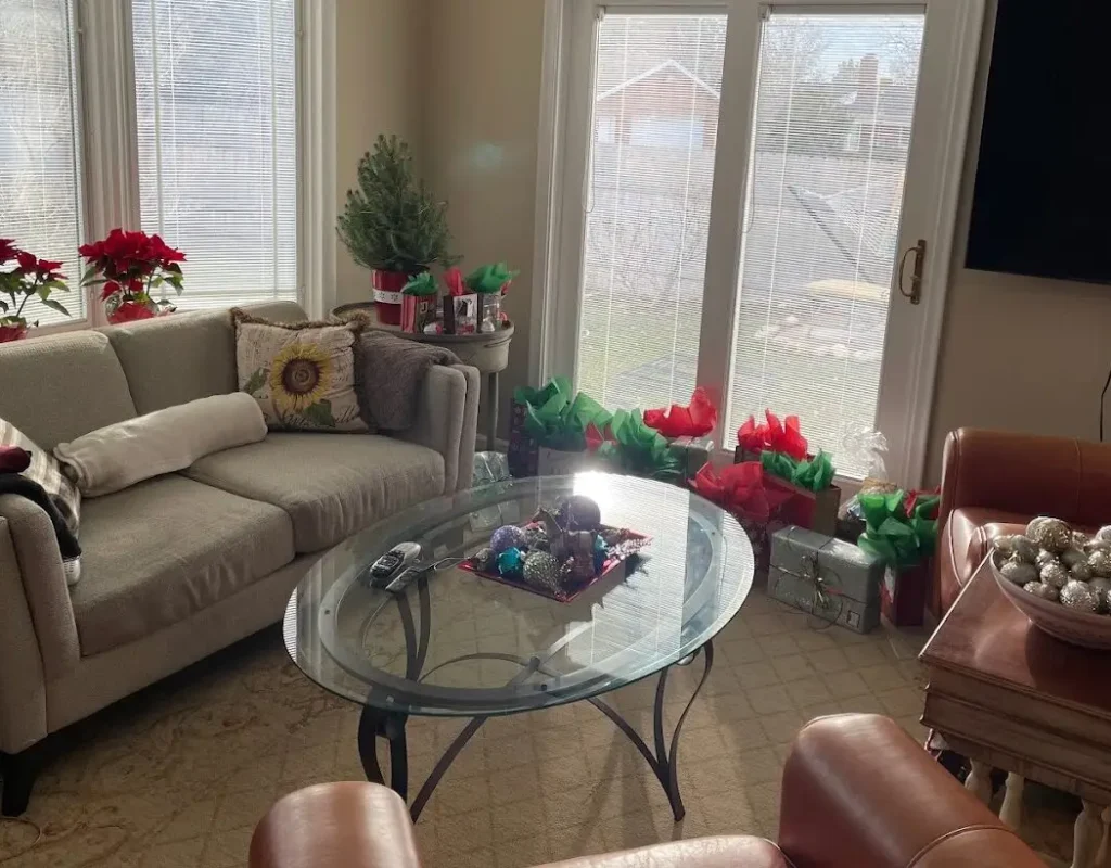 Living room being vacuumed and dusted as part of home cleaning services