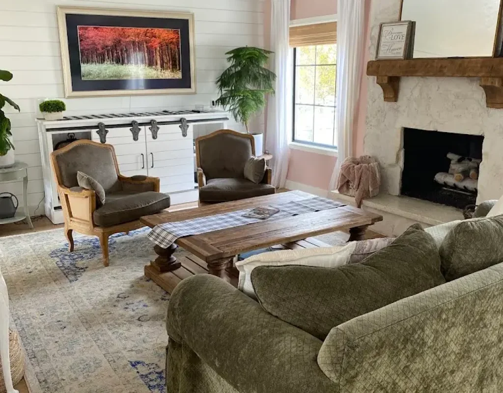 Living room being vacuumed and dusted as part of home cleaning services
