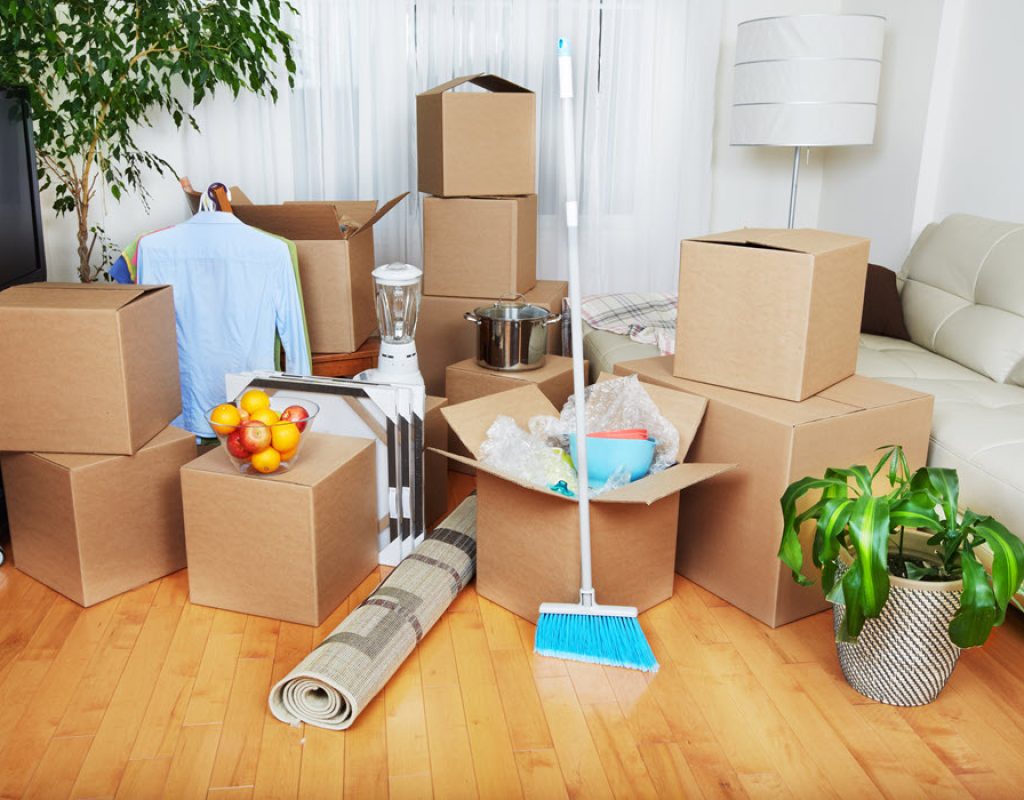 Professional cleaners wiping interior surfaces during detailed move out cleaning service.