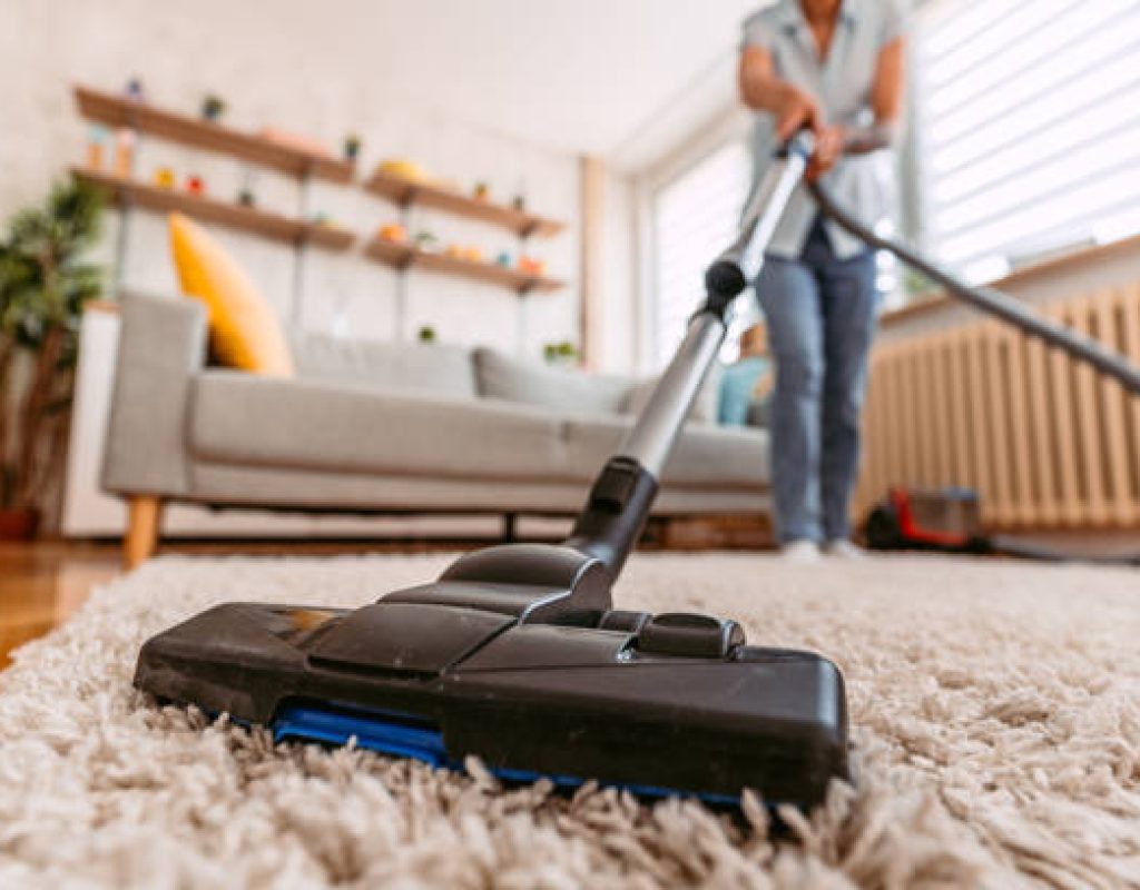 Beehive House Cleaning team scrubbing and sanitizing kitchen surfaces
